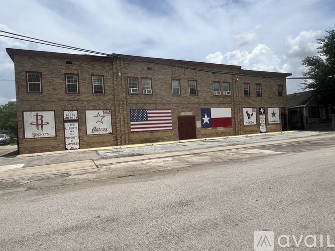 A building with a flag on it and a sign that says Avail.