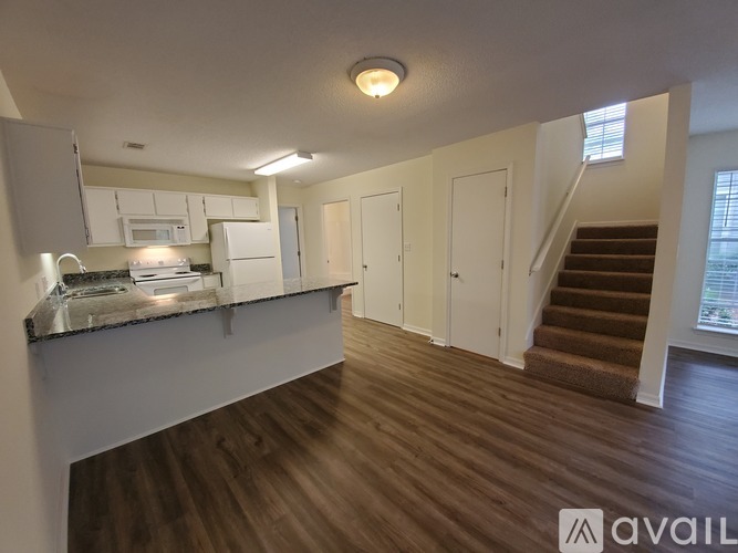 A kitchen with a stove top oven and a counter top.