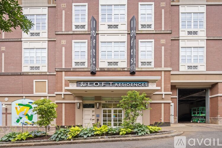 The Lofte Residences is a large brick building with a sign on the front.