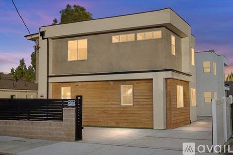 A modern house with a garage is available for sale.