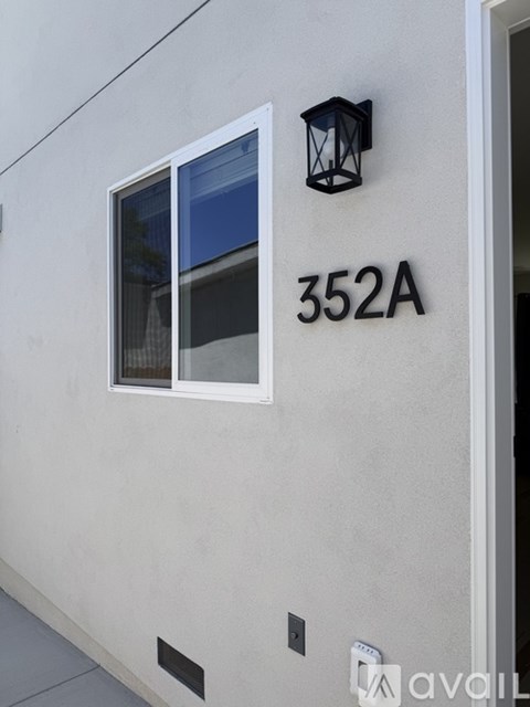 A modern building with the number 352A on it.