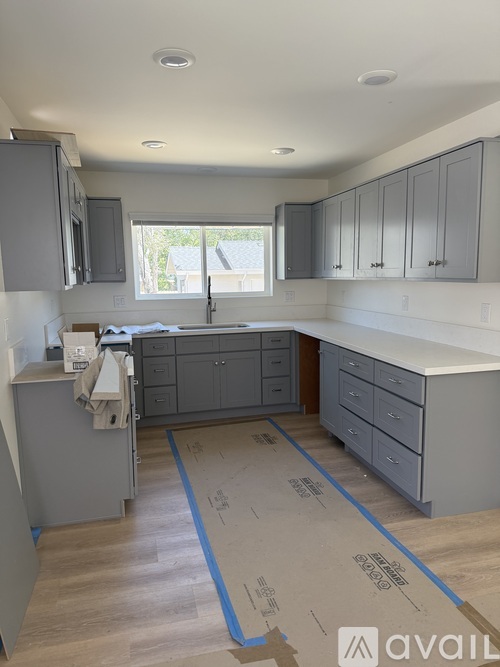 A kitchen under construction with cabinets and a countertop.
