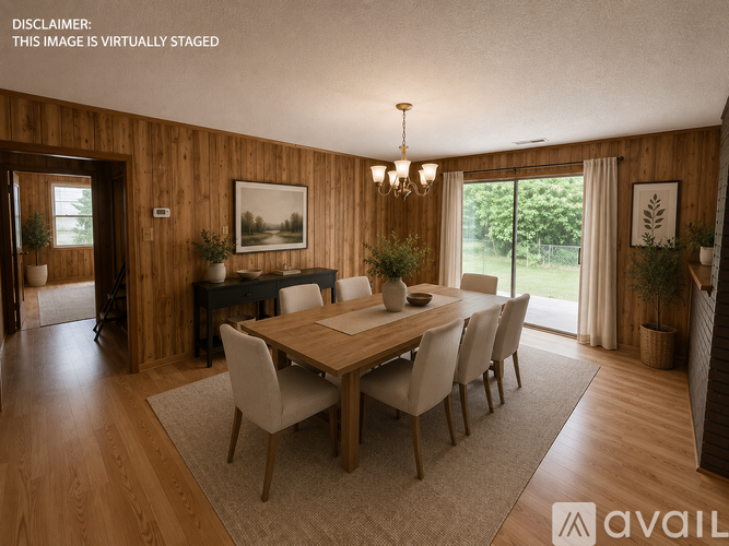 A dining room with a wooden table and chairs.