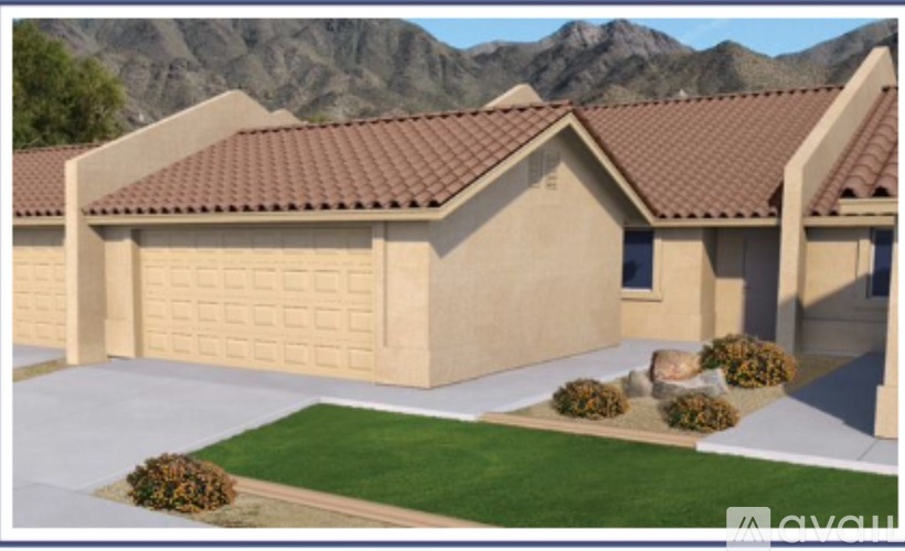 A house with a brown roof and a garage door.