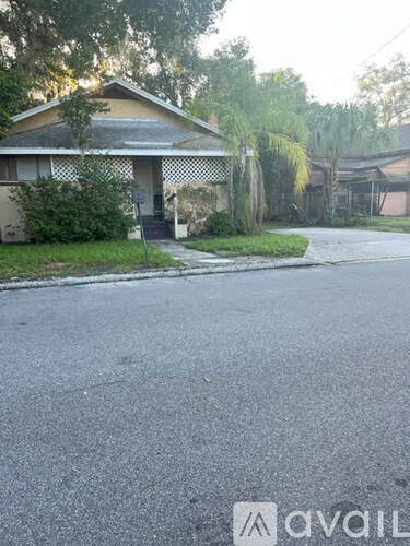 A house with a driveway in front of it.