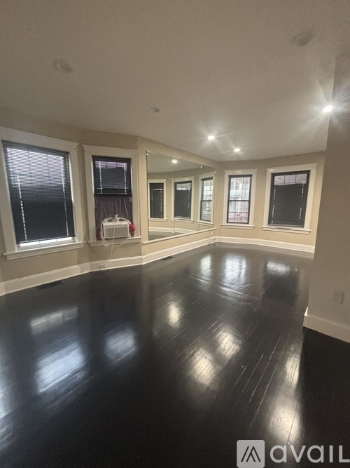 A room with black floors and white walls.