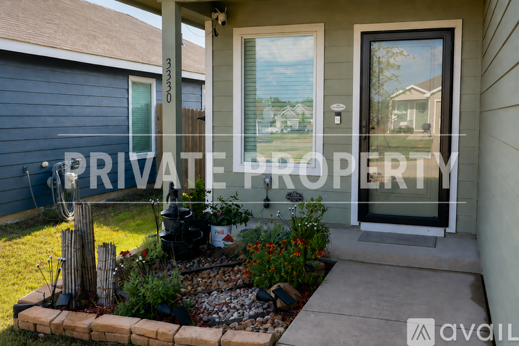 A private property sign is displayed in front of a house.