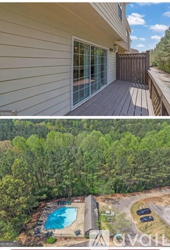 A house with a deck and a pool in the backyard.