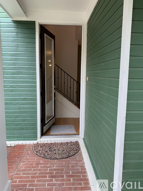 A doorway with a white mat on the floor.