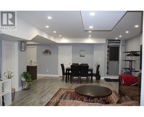 A dining room with a table set for six.