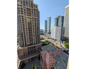 A view of a cityscape with a mix of modern and older buildings.