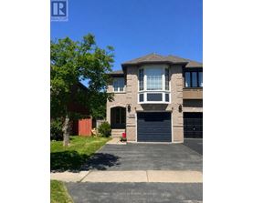 A two-story house with a garage is for sale.
