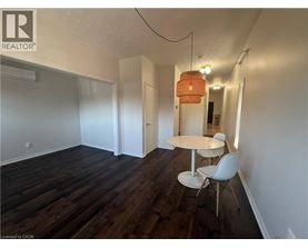 A room with a table and chairs in it.