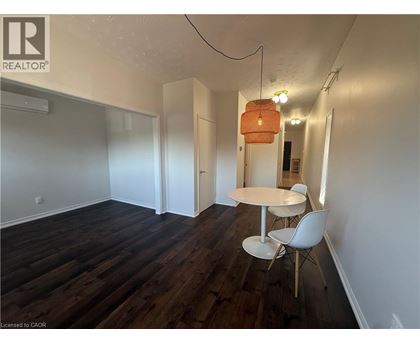 A room with a table and chairs in it.