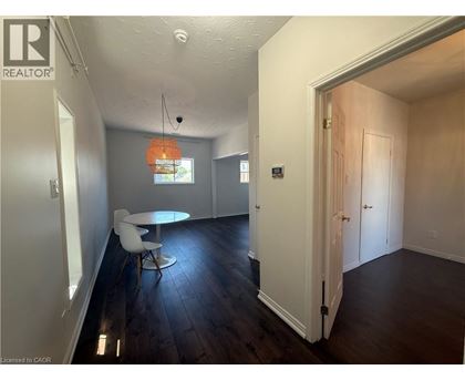 A room with a table and chairs in it.
