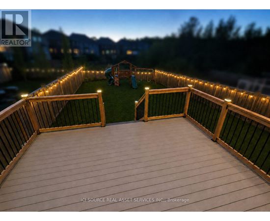A deck with lights and a slide in the background.