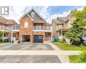 A large brick house with a garage is for sale.