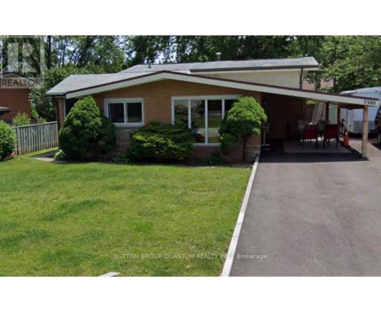 A house with a lawn in front of it.