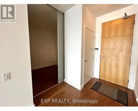 A room with a white door and a brown door.