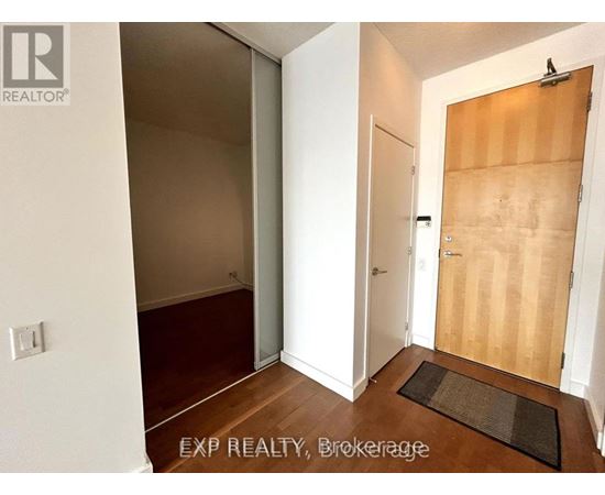A room with a white door and a brown door.