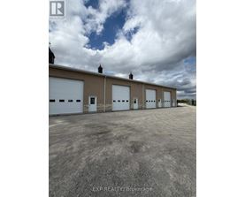 A building with the sign EXP Realty Brokerage on it.