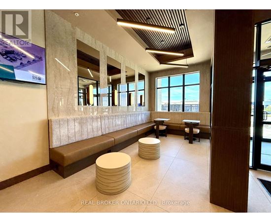 A lobby with a bench and a large window.