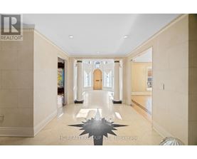 A spacious hallway with a large star-shaped object on the floor.