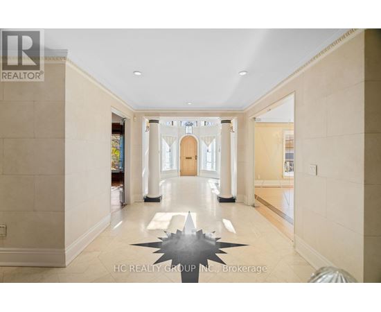 A spacious hallway with a large star-shaped object on the floor.