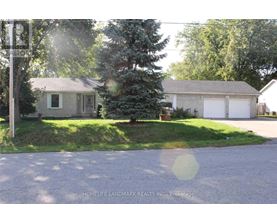 A house with a driveway in front of it.