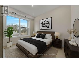 A bedroom with a large bed, a potted plant, and a mirror on the wall.