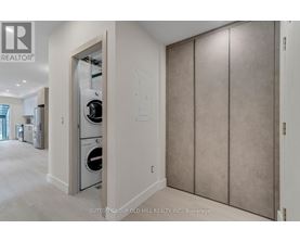A laundry room with a washer and dryer in it.
