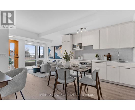 A modern kitchen with a dining table set for four.