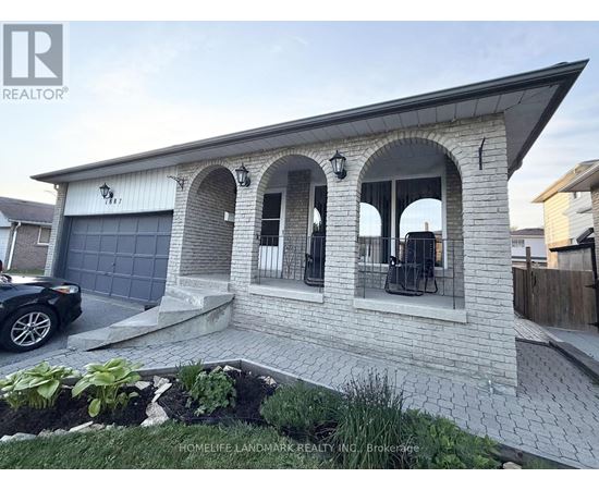 A house with a garage and a car parked in front.