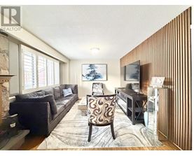 A living room with a fireplace and a couch.