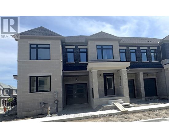 A modern two-story house with a flat roof and large windows.
