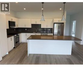 A modern kitchen with a large island in the center.