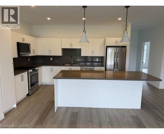 A modern kitchen with a large island in the center.