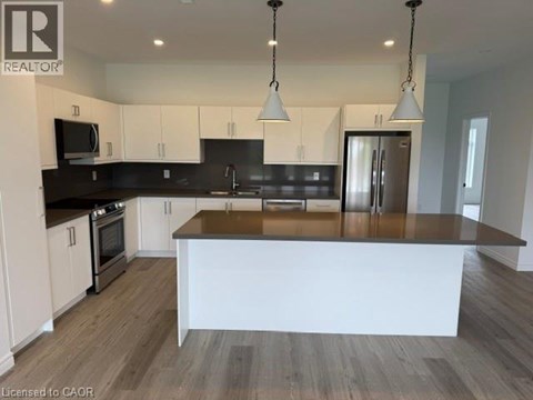 A modern kitchen with a large island in the center.