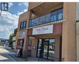 A building with a sign that says Tips n Toes Day Spa.