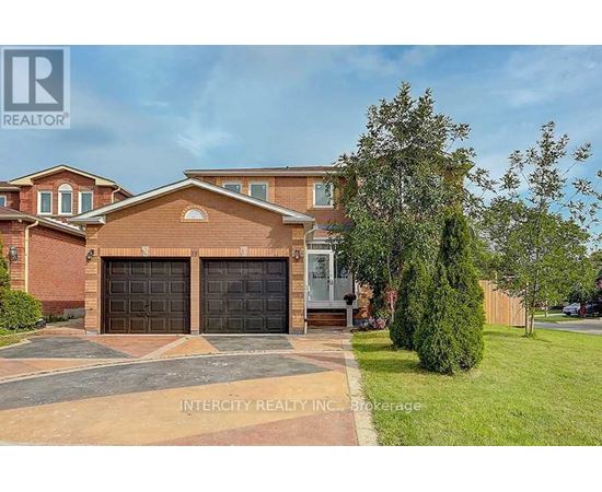 A house with a brown roof and two garage doors is for sale.