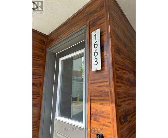 A wooden door with the number 1663 on it.