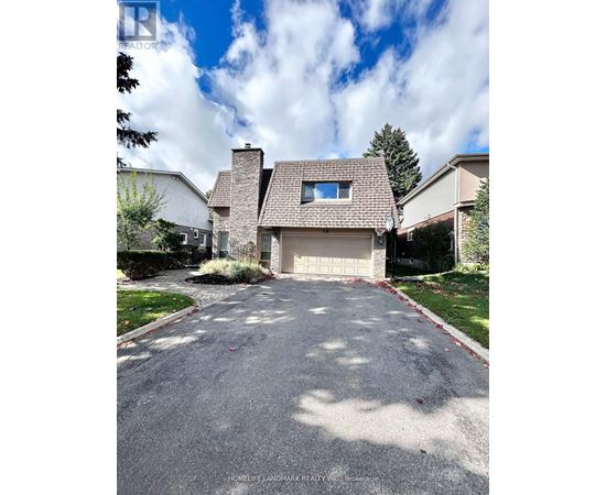 A house with a driveway in front of it.