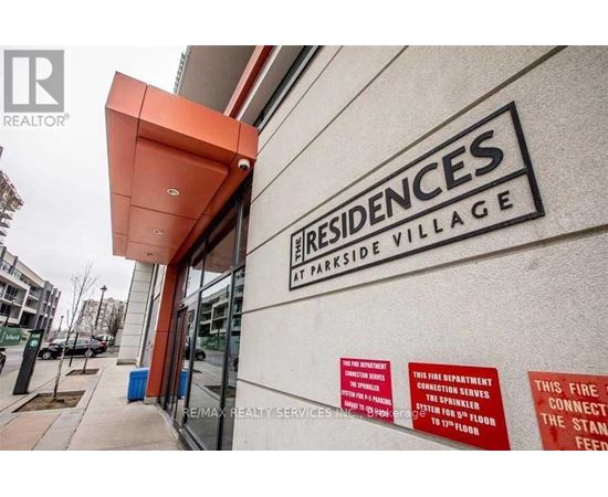 The front of a building with a sign that says Residences at Parkside Village.