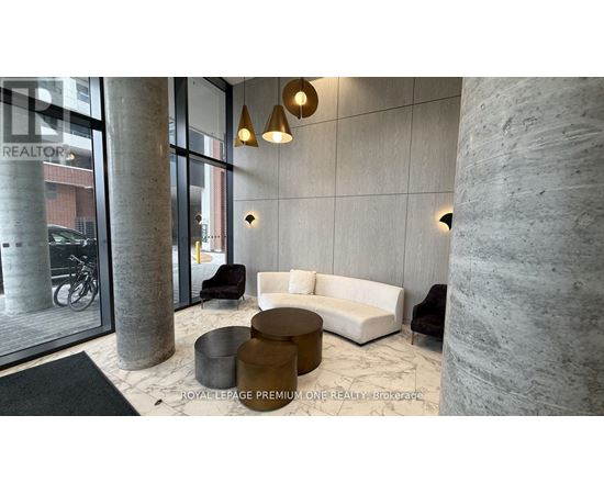 A modern living room with a large window and a bicycle outside.
