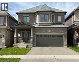 A house with a garage is for sale.