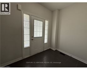 A room with a door and a window with a glass pane.