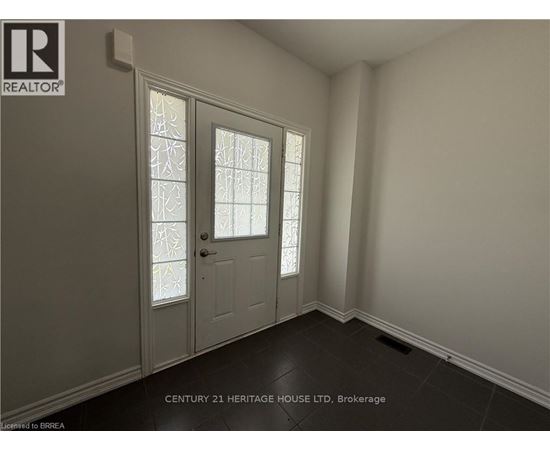 A room with a door and a window with a glass pane.