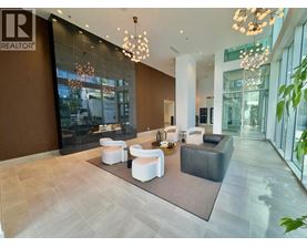 A modern living room with a brown accent wall and a glass door.