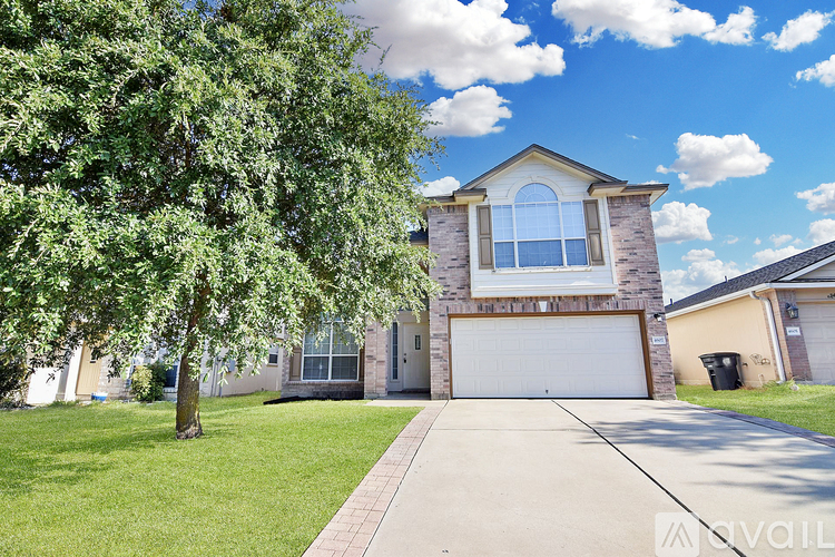 A house with a garage is available for sale.