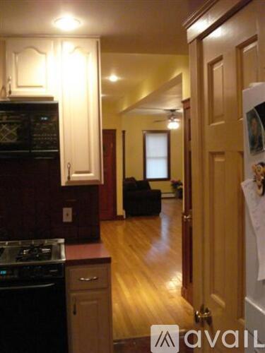 A kitchen with a dishwasher and a refrigerator.
